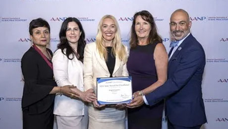 Brighid Gannon, Lavender Co-Founder receiving the AANP State Award for Excellence